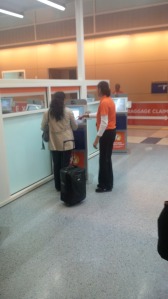 Passenger receives assistance using the new Automated Passport Control system